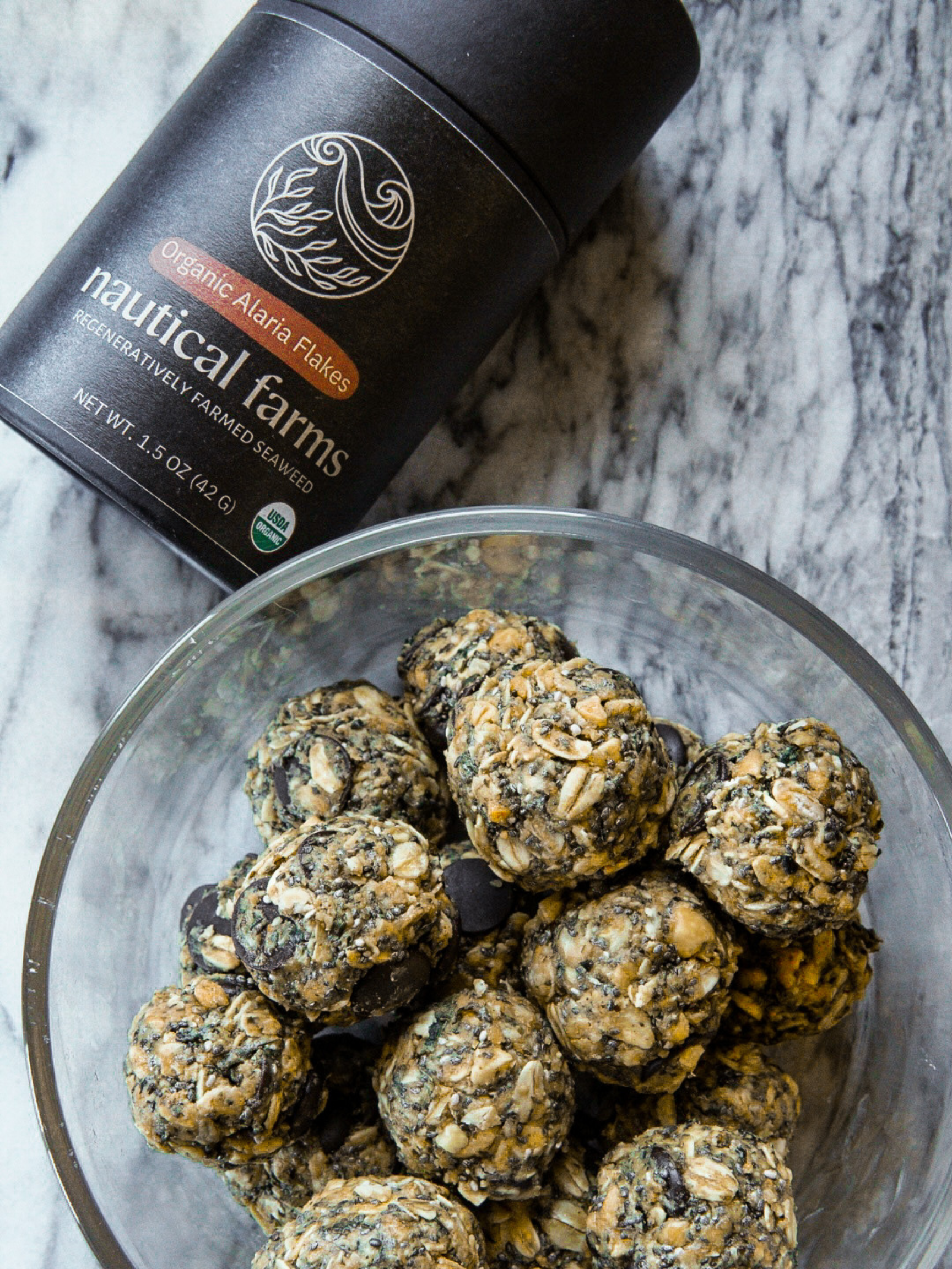 Healthy and sustainable alaria (wakame) flakes from regenerative ocean aquaculture farm in Maine. 1.5 oz of sustainable Sea Vegetables in a kraft black tube.